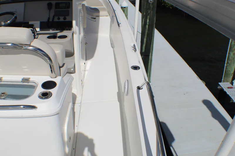 Slide: The Image of 2017 Boston Whaler 270 Dauntless boat interior with seating and control panel. - 16