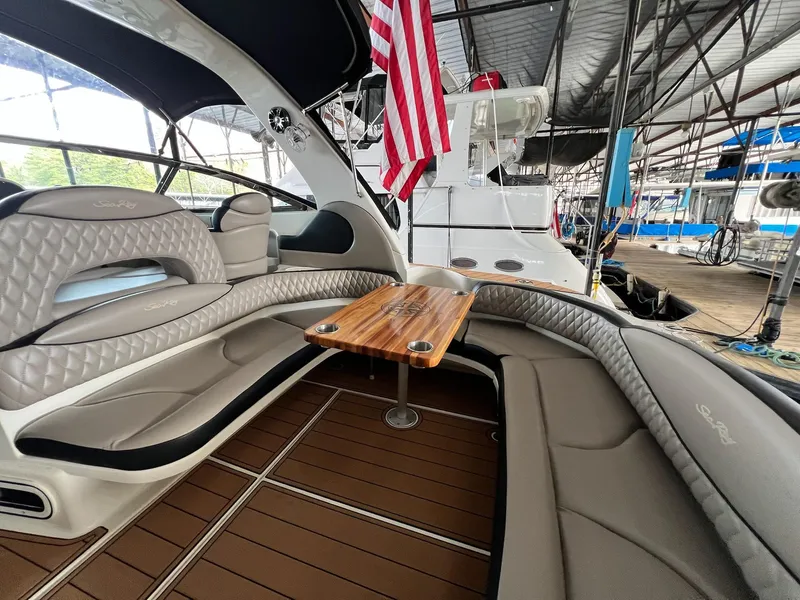 Slide: The Image of Interior of 2002 Sea Ray 380 Sundancer yacht with seating and table. - 10
