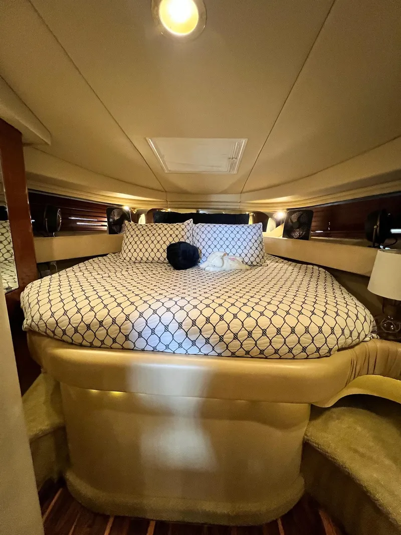 Slide: The Image of Luxurious cabin interior of 2002 Sea Ray 380 Sundancer yacht with cozy bedding. - 14