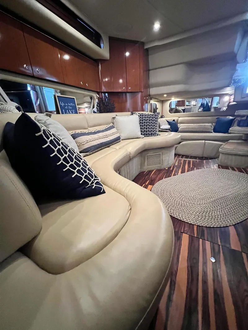 Slide: The Image of Luxurious interior of 2002 Sea Ray 380 Sundancer yacht with plush seating and elegant decor. - 15