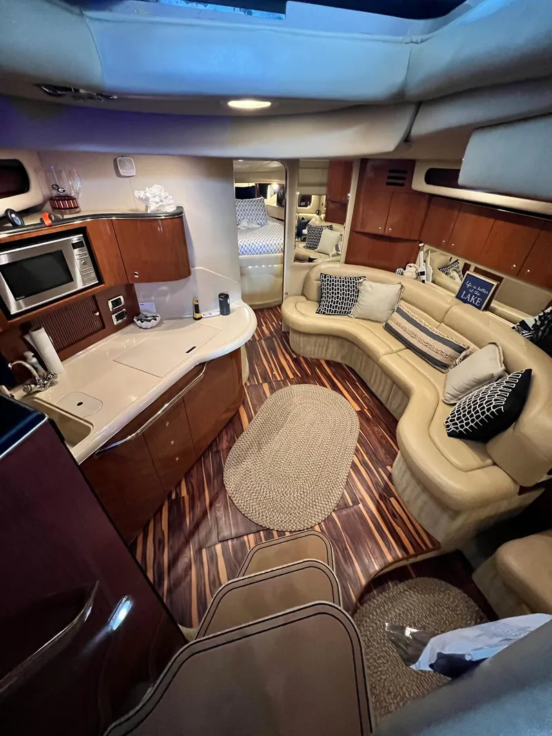 Slide: The Image of Luxurious interior of 2002 Sea Ray 380 Sundancer yacht with modern amenities and elegant design. - 19