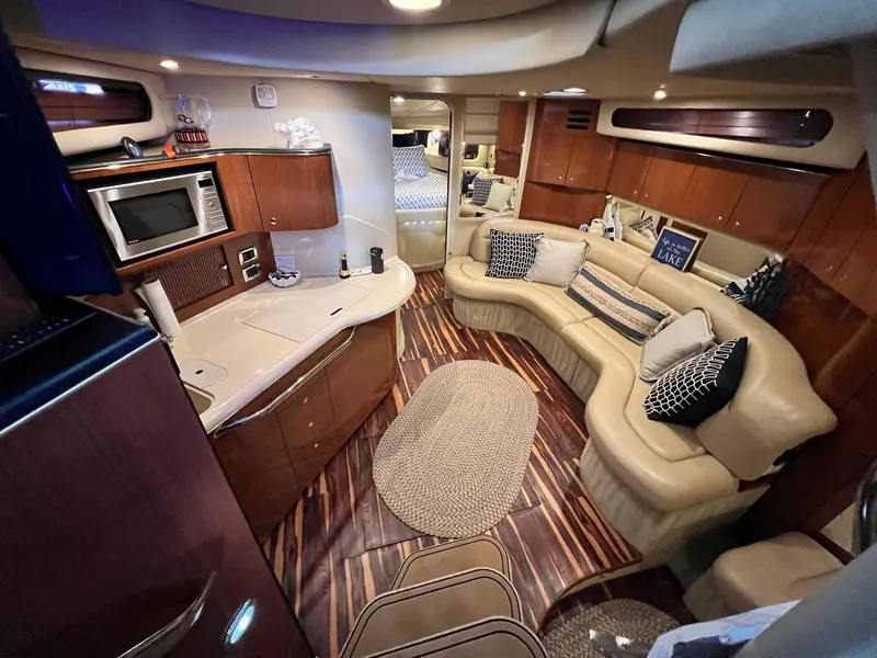 Slide: The Image of Luxurious interior of a 2002 Sea Ray 380 Sundancer yacht with elegant seating and modern amenities. - 20