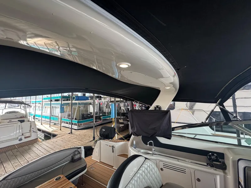 Slide: The Image of Interior view of a 2002 Sea Ray 380 Sundancer yacht at a marina. - 33