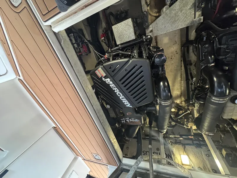 Slide: The Image of Engine compartment of a 2002 Sea Ray 380 Sundancer with Mercury engine. - 37