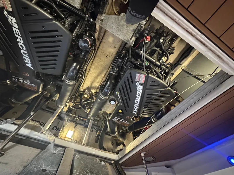 Slide: The Image of Engine room of 2002 Sea Ray 380 Sundancer with twin Mercury engines. - 38