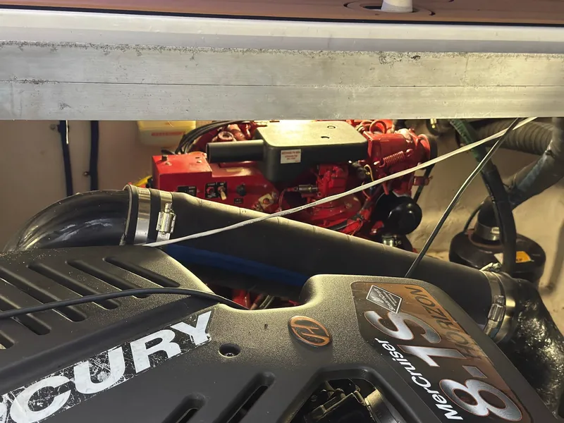 Slide: The Image of Engine compartment of a 2002 Sea Ray 380 Sundancer with Mercury components visible. - 39