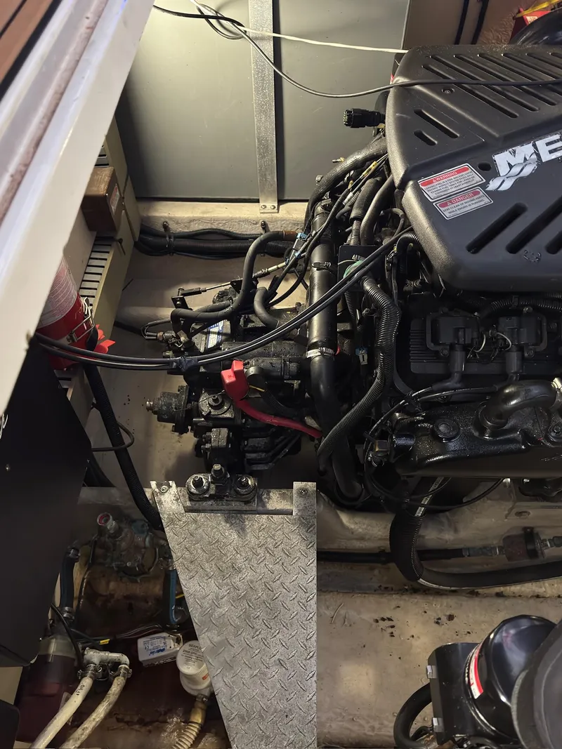 Slide: The Image of Engine compartment of a 2002 Sea Ray 380 Sundancer boat, showing detailed mechanical components. - 40