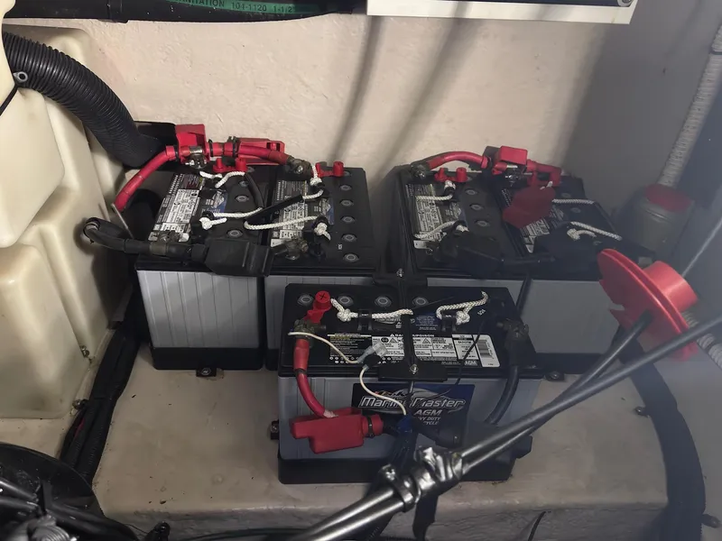 Slide: The Image of Batteries in a 2002 Sea Ray 380 Sundancer boat engine compartment. - 42