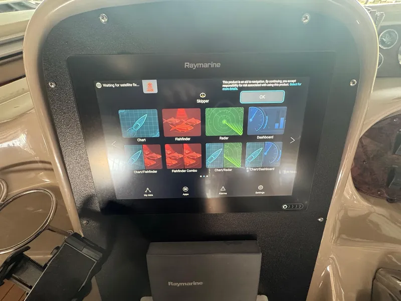 Slide: The Image of Raymarine navigation display on 2002 Sea Ray 380 Sundancer boat dashboard. - 44