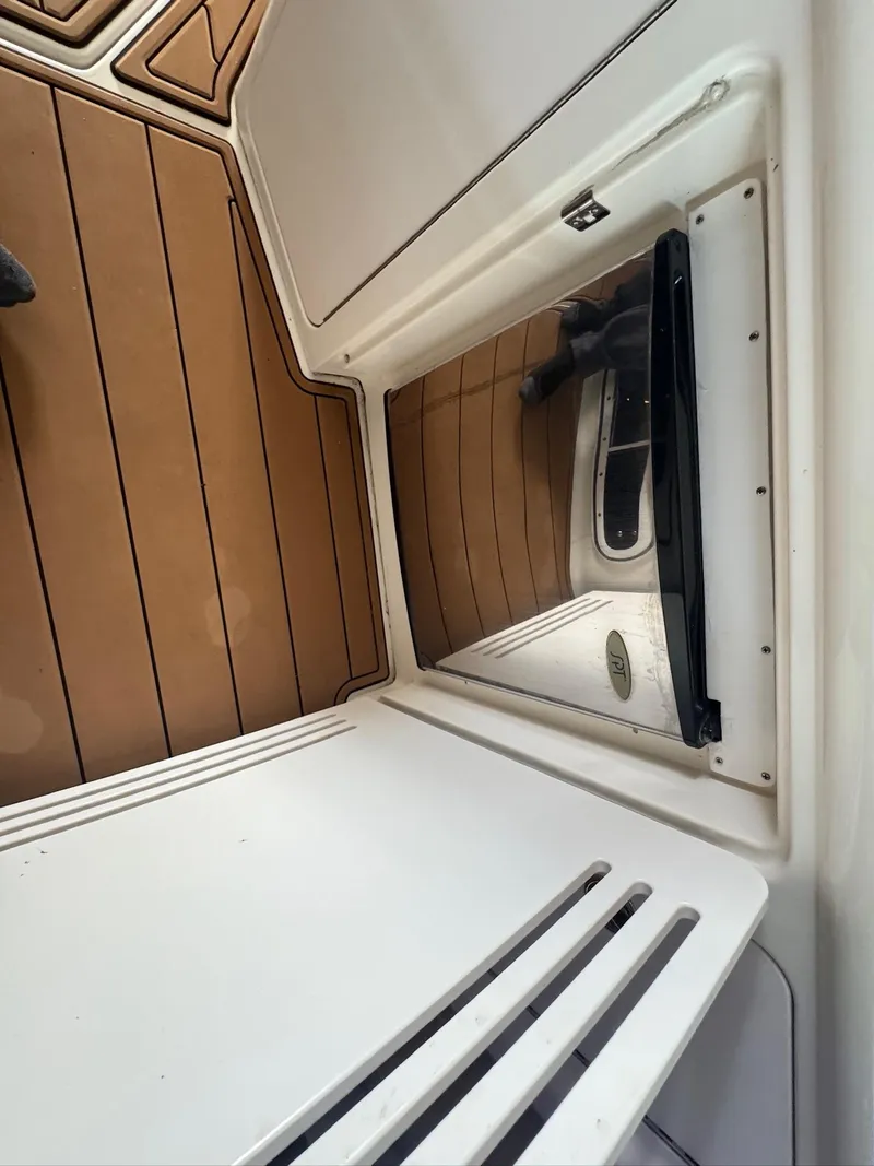 Slide: The Image of 2002 Sea Ray 380 Sundancer cabin interior with wood flooring and storage compartment. - 45