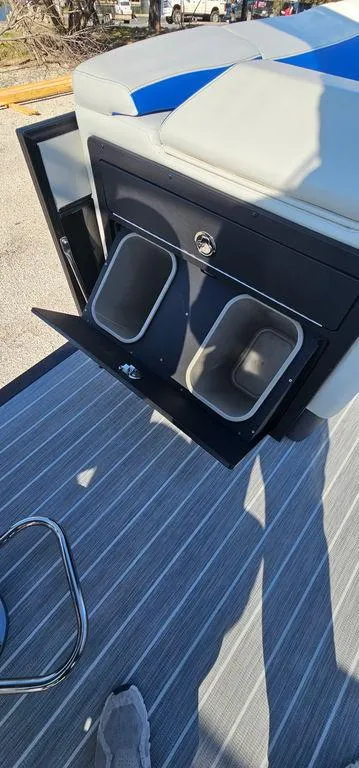 Slide: The Image of 2022 Berkshire 25E STS boat with built-in storage compartments and seating. - 13