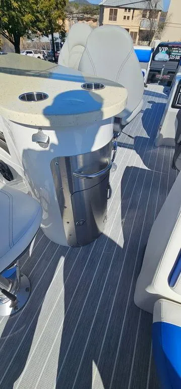 Slide: The Image of 2022 Berkshire 25E STS boat interior with seating and table, featuring modern design elements. - 17