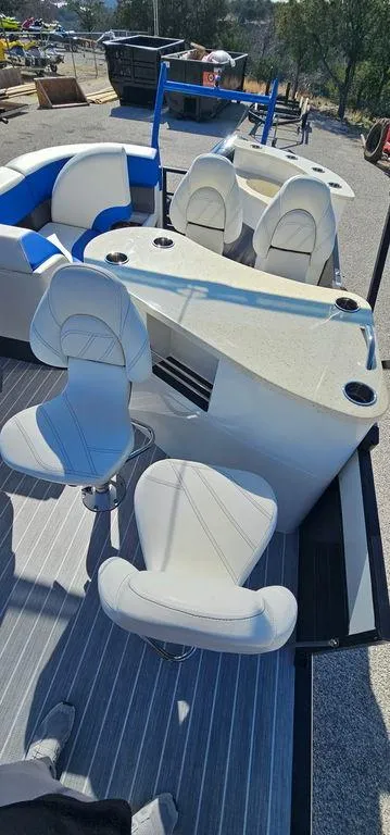 Slide: The Image of 2022 Berkshire 25E STS pontoon boat interior with white seating and sleek design. - 21