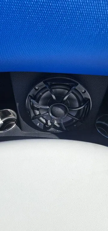Slide: The Image of Speaker and cup holders on 2022 Berkshire 25E STS boat interior. - 23