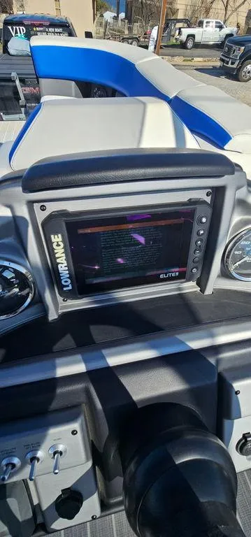 Slide: The Image of 2022 Berkshire 25E STS boat dashboard with Lowrance Elite display. - 24