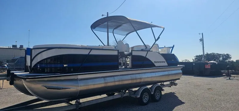 Slide: The Image of 2022 Berkshire 25E STS pontoon boat on trailer in sunny outdoor setting. - 5