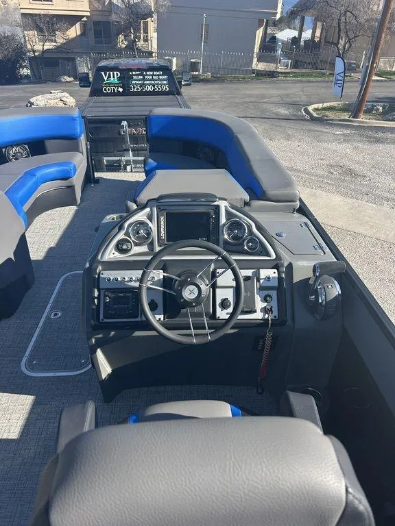 Slide: The Image of 2023 Berkshire 25UL STS 3.0 boat interior with modern dashboard and seating. - 10