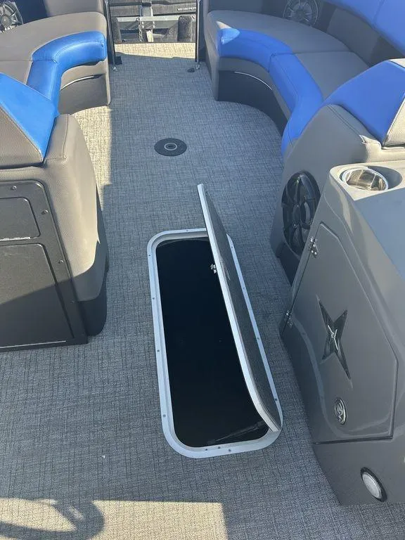 Slide: The Image of 2023 Berkshire 25UL STS 3.0 boat interior with open storage compartment. - 13