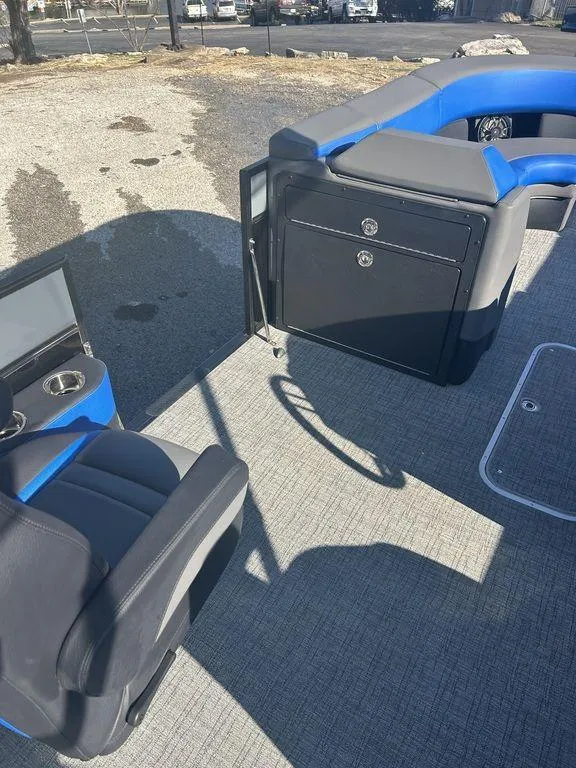 Slide: The Image of 2023 Berkshire 25UL STS 3.0 boat interior with seating and storage compartments. - 15