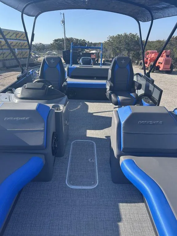 Slide: The Image of 2023 Berkshire 25UL STS 3.0 pontoon boat with blue and gray seating, spacious deck. - 21