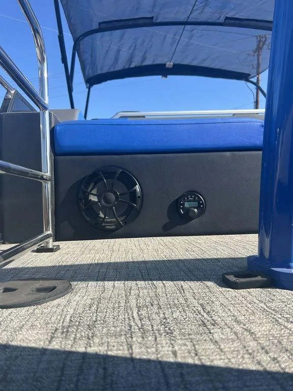 Slide: The Image of 2023 Berkshire 25UL STS 3.0 boat interior with blue seating and speaker system. - 6