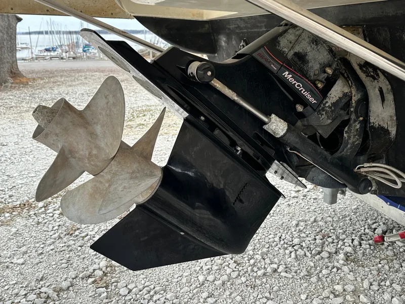 Slide: The Image of Propeller and drive of 2012 Sea Ray 280 Sundancer boat on gravel surface. - 4