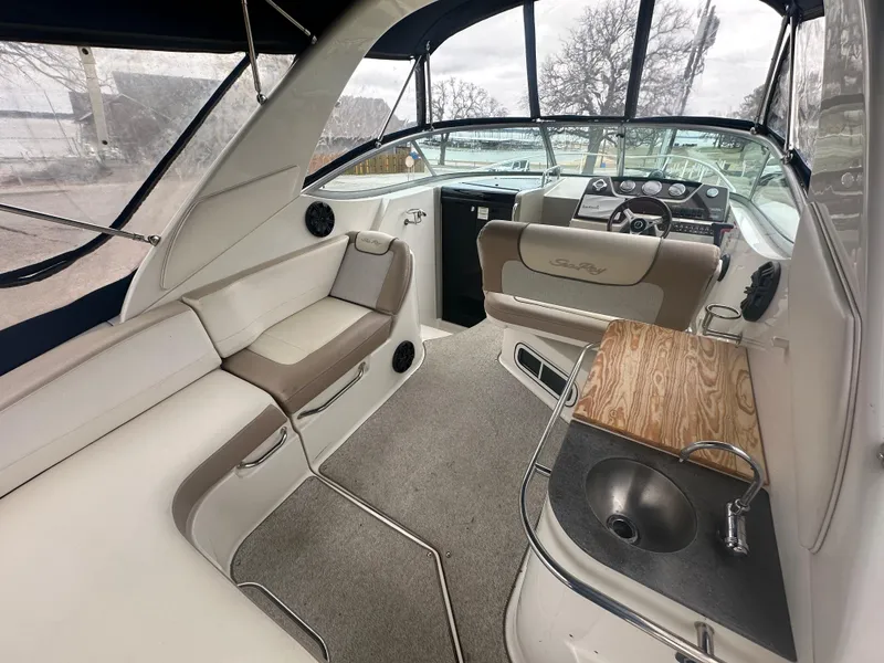 Slide: The Image of Interior of 2012 Sea Ray 280 Sundancer boat with seating and kitchenette. - 5