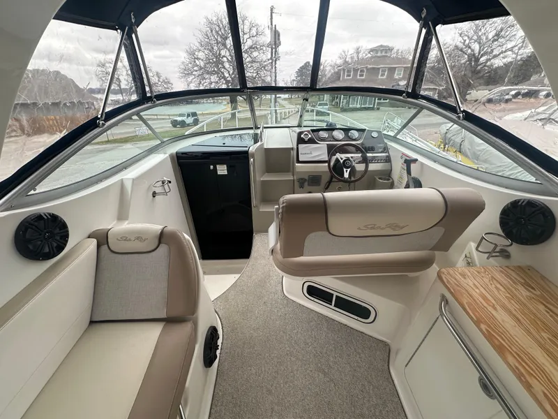 Slide: The Image of 2012 Sea Ray 280 Sundancer interior with helm, seating, and dashboard. - 6