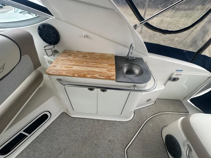 Slide: The Image of Interior of 2012 Sea Ray 280 Sundancer with sink and wooden countertop. - 9