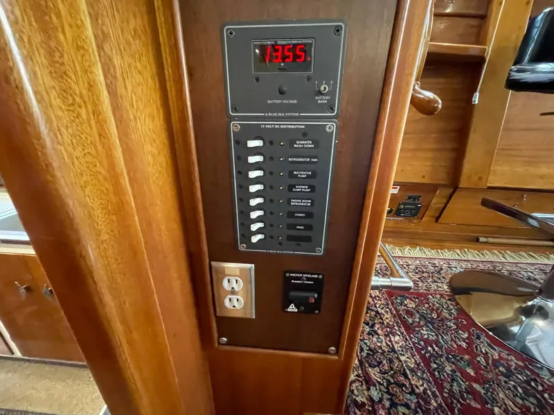 Slide: The Image of 1959 Monk Express Cruiser control panel with switches and digital display. - 25