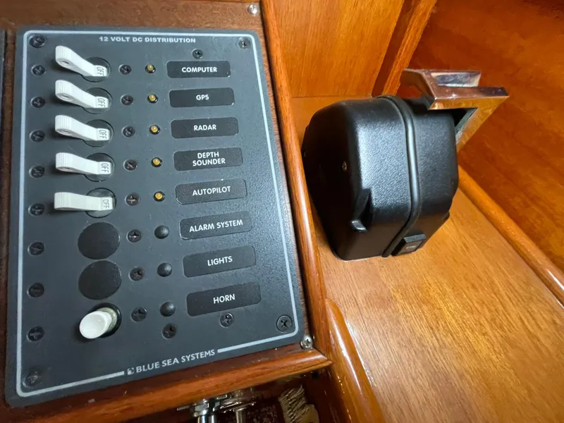 Slide: The Image of 1959 Monk Express Cruiser control panel with switches for GPS, radar, and more. - 30