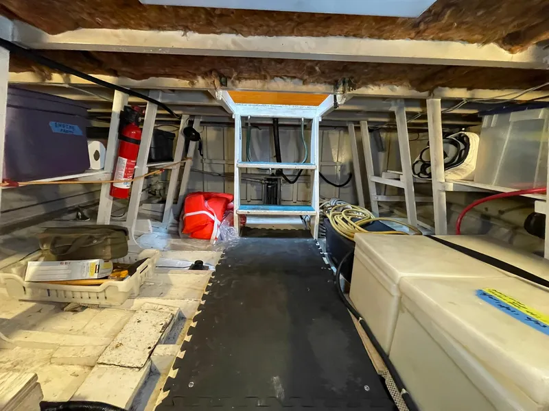 Slide: The Image of Interior of a 1959 Monk Express Cruiser showing storage and equipment. - 38