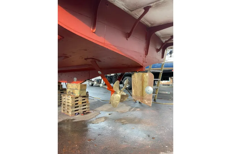 Slide: The Image of Underneath view of a 1959 Monk Express Cruiser showing propeller and rudder. - 43