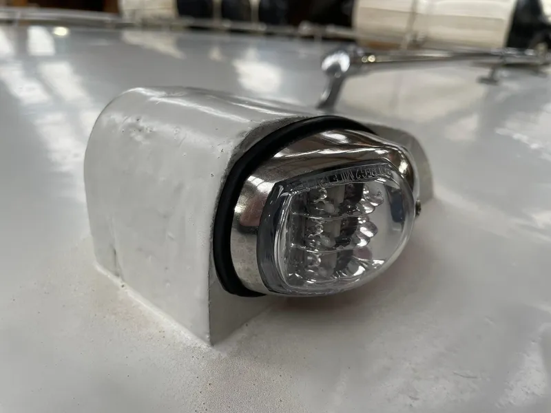 Slide: The Image of 1959 Monk Express Cruiser navigation light on a white surface. - 9