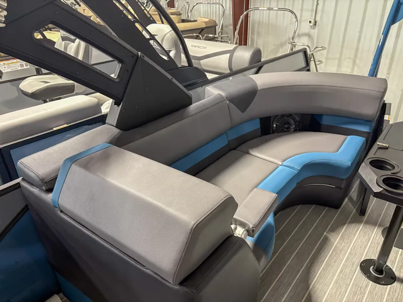 Slide: The Image of 2025 Trifecta 23RF SS 3.0 boat interior with gray and blue seating, cup holders, and modern design. - 11