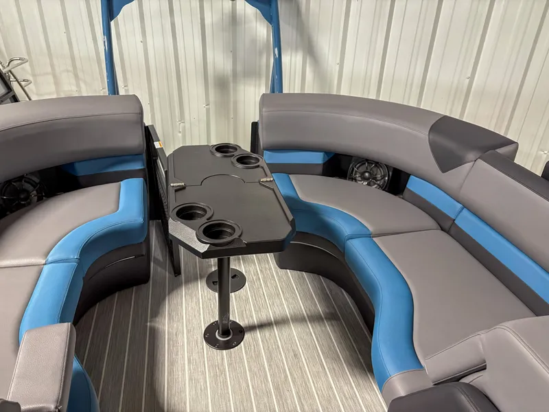 Slide: The Image of Interior of 2025 Trifecta 23RF SS 3.0 pontoon boat with blue and gray seating. - 13