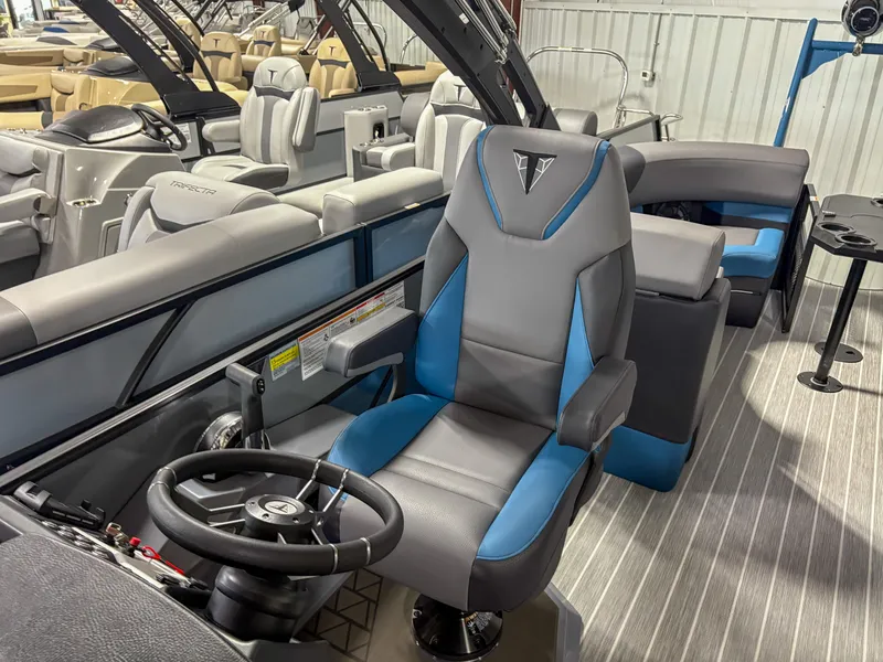 Slide: The Image of 2025 Trifecta 23RF SS 3.0 boat interior with modern seating and steering wheel. - 5