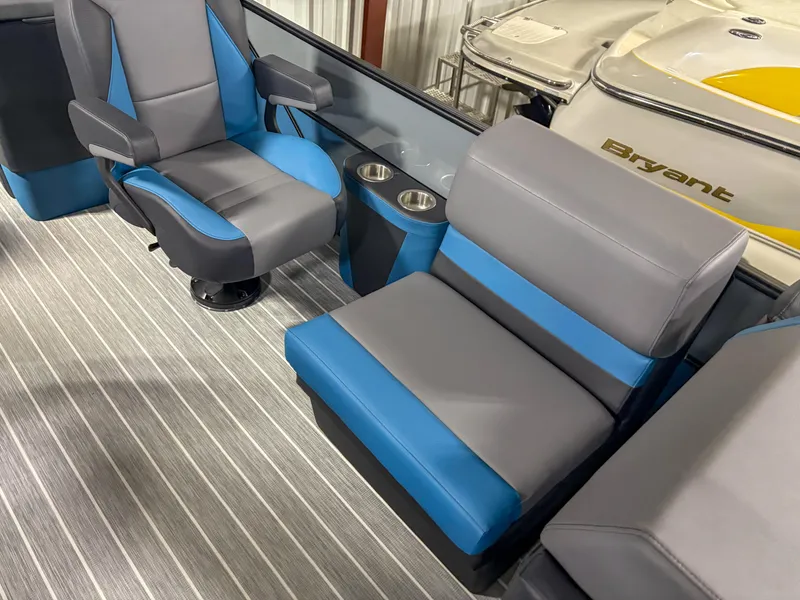 Slide: The Image of 2025 Trifecta 23RF SS 3.0 boat interior with gray and blue seating, striped flooring. - 7