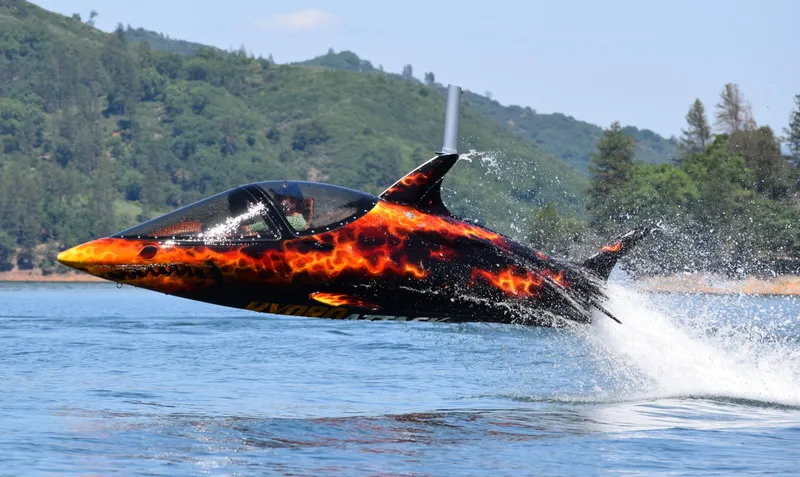 Slide: The Image of A 2025 Seabreacher X model with fiery design leaping from water. - 10