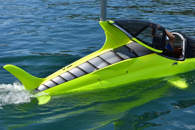 Slide: The Image of Futuristic 2025 Seabreacher X, Y, Z submersible in vibrant yellow on water. - 16