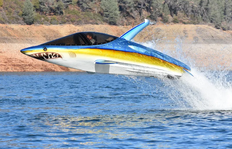 Slide: The Image of 2025 Seabreacher X, Y, Z model, shark-themed watercraft leaping from water. - 24
