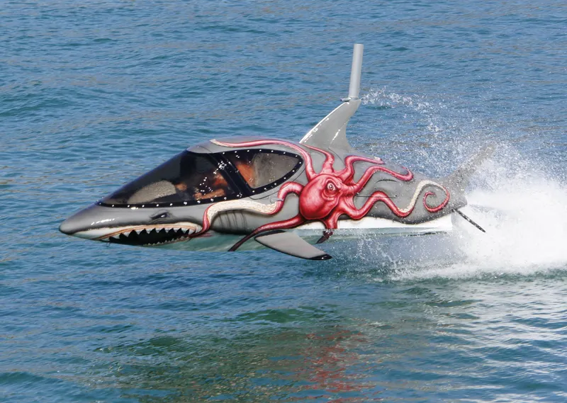 Slide: The Image of Futuristic 2025 Seabreacher X, Y, Z submarine with shark design and octopus artwork on water. - 36