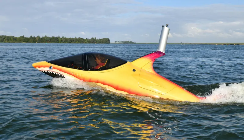 Slide: The Image of 2025 Seabreacher X, Y, Z submarine resembling a shark, cruising on open water. - 38