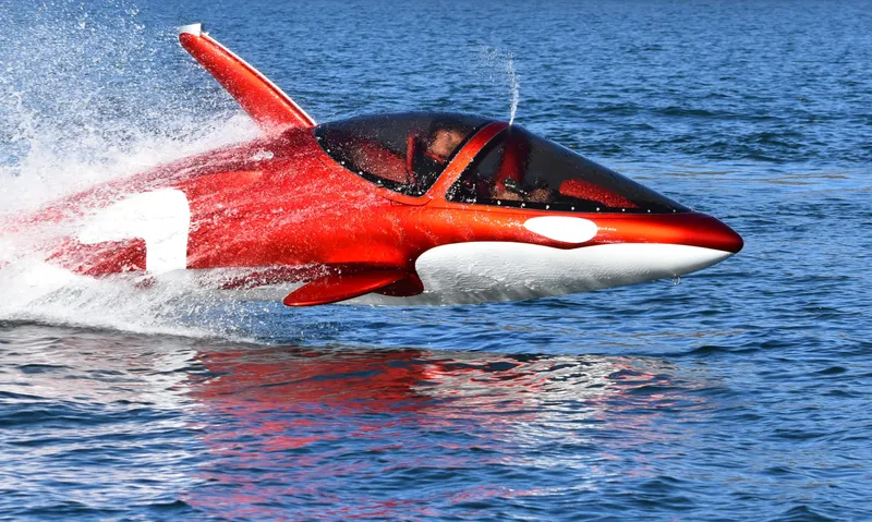 Slide: The Image of 2025 Seabreacher X, Y, Z submersible watercraft resembling an orca, speeding on the ocean surface. - 4