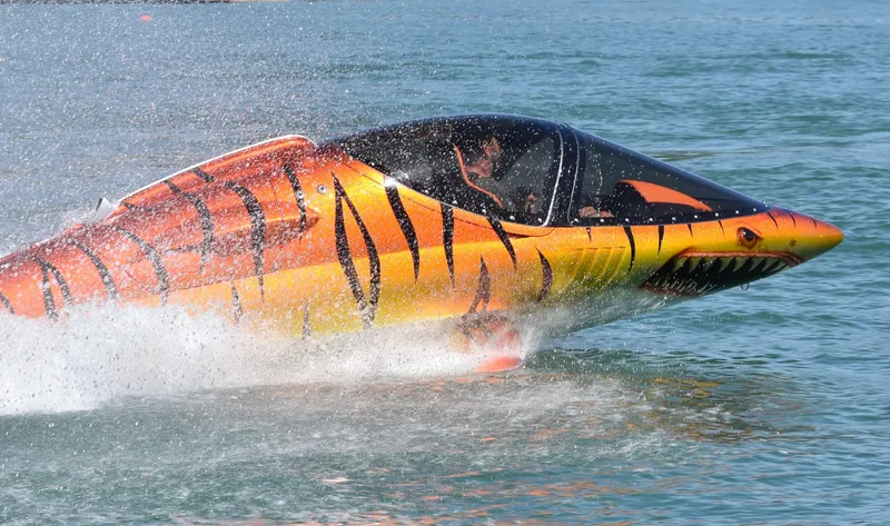 Slide: The Image of Futuristic 2025 Seabreacher X, Y, Z submersible with vibrant tiger-striped design on water. - 46