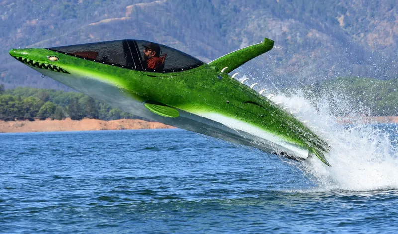 Slide: The Image of Futuristic 2025 Seabreacher X, Y, Z model, green shark design, leaping from water. - 6