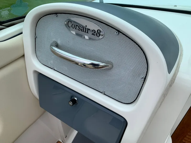 Slide: The Image of 2005 Chris-Craft Corsair 28 dashboard with sleek design and chrome accents. - 27