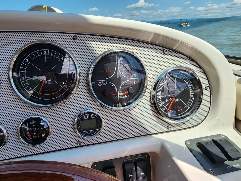 Slide: The Image of Dashboard of a 2006 Chris-Craft Corsair 28 boat with gauges and controls. - 40