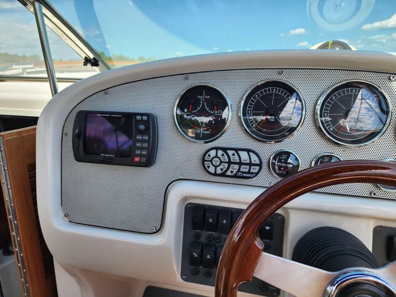 Slide: The Image of Dashboard of a 2006 Chris-Craft Corsair 28 boat with gauges and controls. - 41