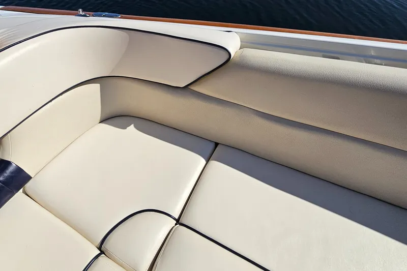 Slide: The Image of 2006 Chris-Craft Corsair 28 boat interior with cream leather seating. - 58